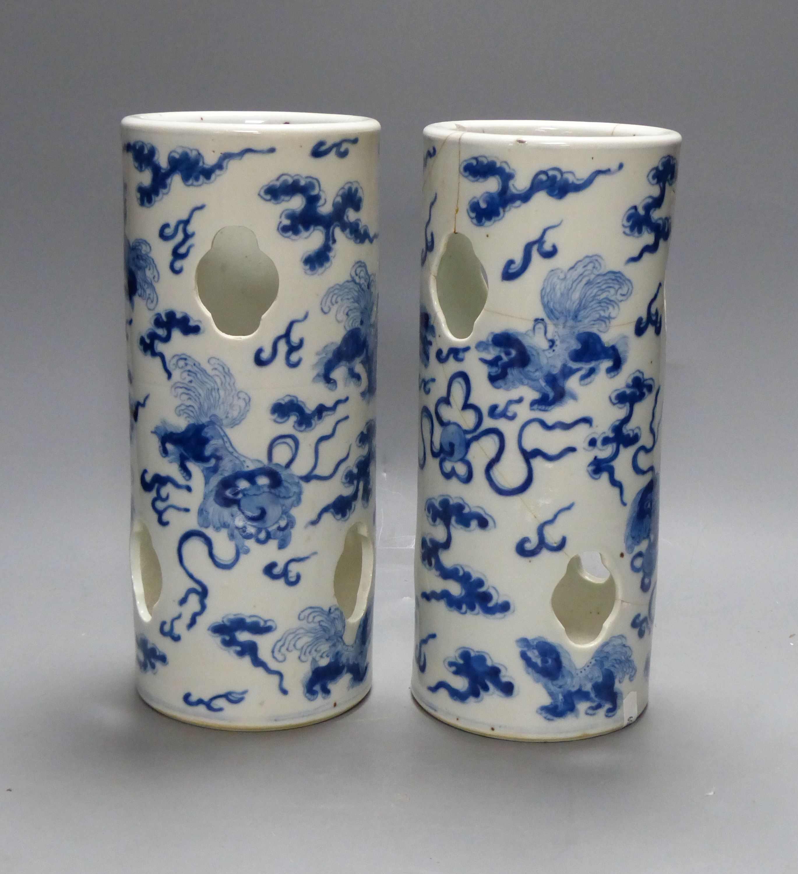 A pair of early 20th century Chinese blue and white hat stands, Kangxi marks, 29cm high